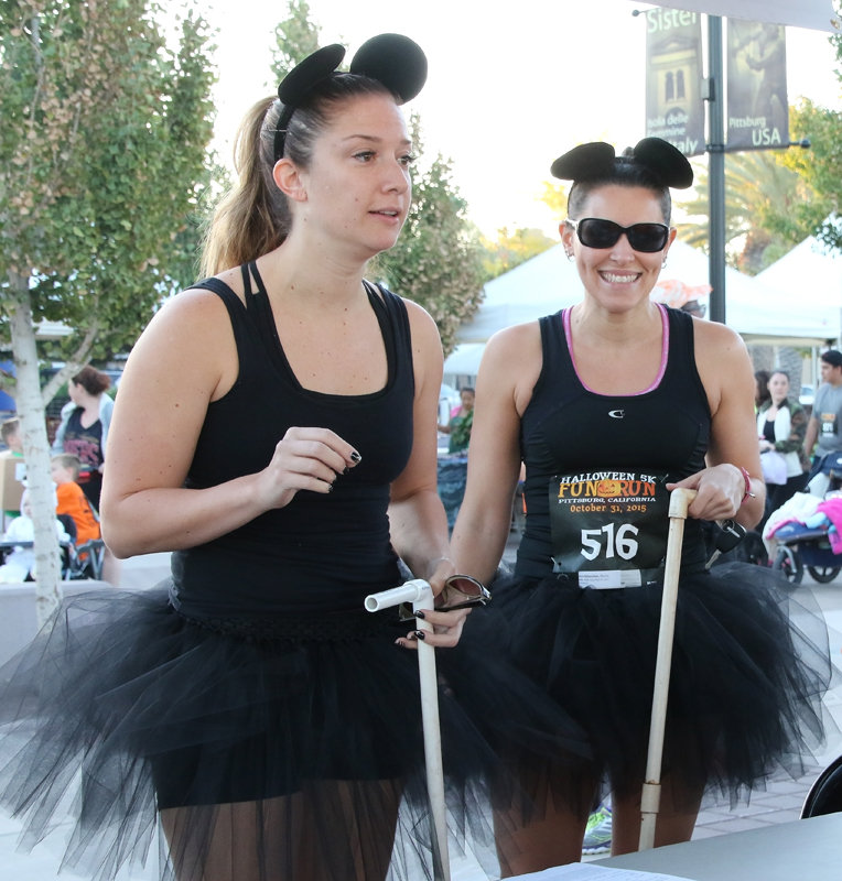 Halloween 5k Run Pittsburg, Ca., The three blind mices. Shown checking in at the registration are Marie Arcidiacono and her friend Alyssa DaRe. They ran the race along with Maries sister Lisa Arcidiancono. They came in as follows, 44, 45 and 46 places. Cathie Lawrence/Experience.