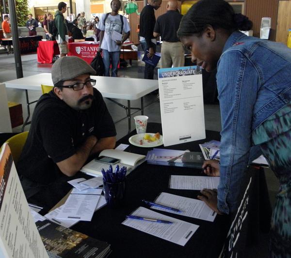 Recruiter Benjamin Ibarra and student Zainab Janneh conversing during Transfer Week 2012.