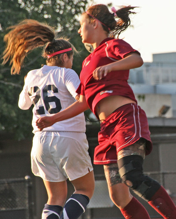 LMCs new addition Lauren Ayers goes up for the ball over a Contra Costa defender in a final second loss. 