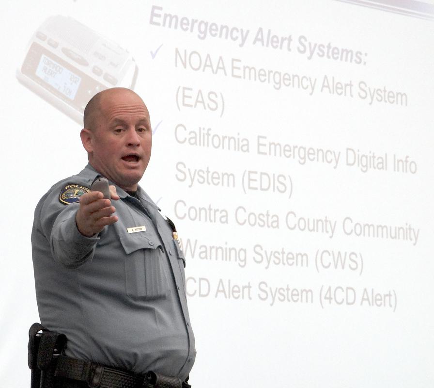 Officer Michael Hotton leads a meeting about safety and emergency preparedness on campus.