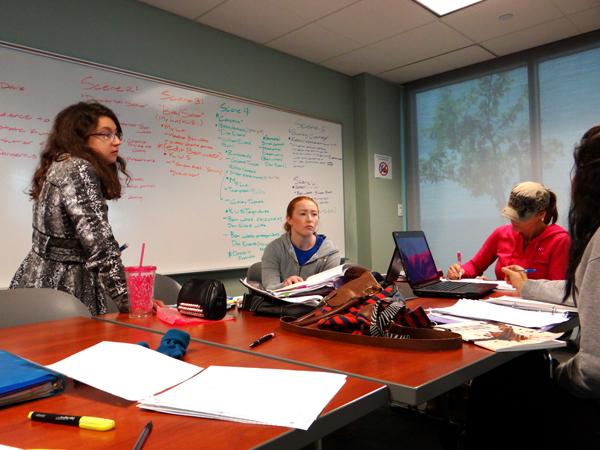 From left, Students, Megan Young, Erin Skowron and Kim Calia gather to use a group; room in the library. 