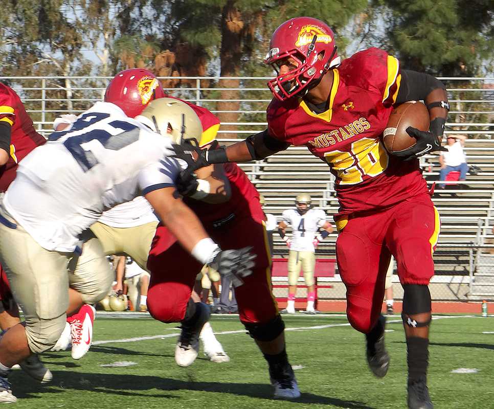 Running back Shawn Vasquez stiff arms a would-be tackler in the Mustangs 25-10 win over the 49ers.