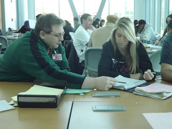 Professor Jeff Cohen and Lauren Marner go over mathematical strategies in the Mathematics Lab. 