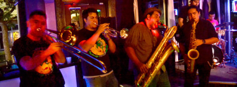 Aaron Craig, Javier Munoz, Marcus Bettencourt and Isaac Fematt play their horns during their show on Oct. 18, 2013.