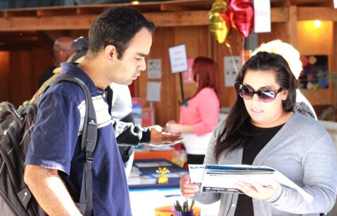 Student Kunal Khanna speaks with Lucie Lombera, a representative from CSU East Bay during the LMC Transfer Day event Monday, Oct. 27 on Level 3 of the College Complex. 