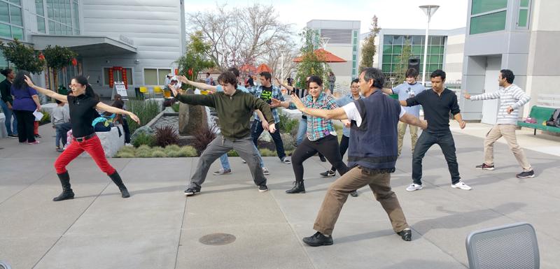 Professor Danny Ramirez hosts the relaxing Tai Chi Workshop on the Student Sevices Center patio. 