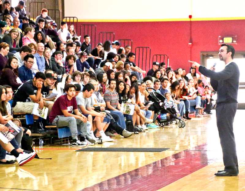 Drama instructor Nick Garcia speaks to high school students inside the Gymnasium during Senior Saturday, April 18.