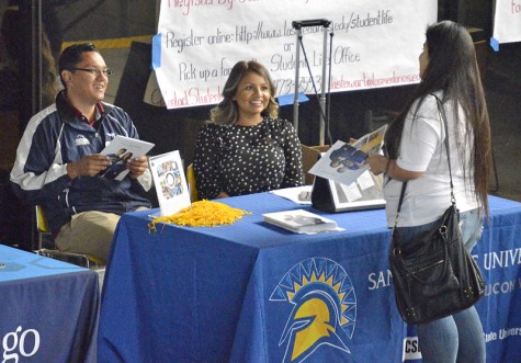 California State University, San Jose representative Drew Agbay, left, works with a colleague to inform prospective students during the Transfer Day event Oct. 27 in the Indoor Quad. Photos by Joseph Delano.