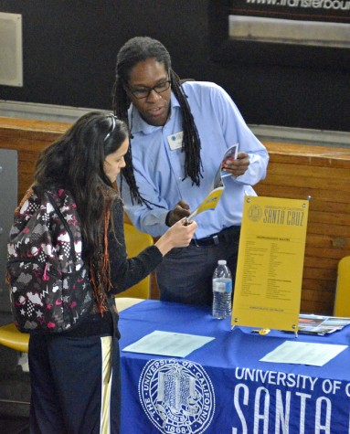 Patrick Novak from University of California, Santa Cruz explained materials to curious attendees of the Transfer Day event in the Indoor Quad Oct. 27.