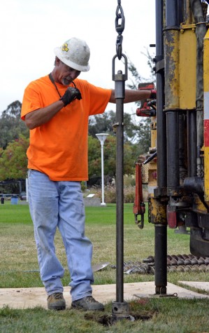 Brant Snyder from Krazan is drilling a 50- foot deep hole for samples of the underlying soil Monday, Nov 27. 