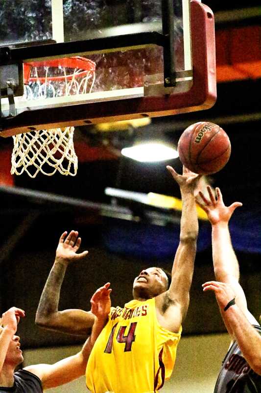 Freshman Osh’e White goes up for the rebound as LMC defeated Simpson University JV 100-72.