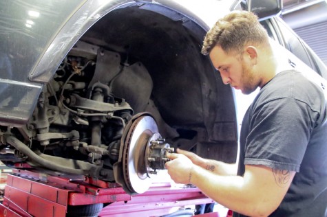 LMC Automotive, December 2, 2015. Brake day is wednesday at LMC, Fernando Vallejo is changing and resetting brakes. Cathie Lawrence/Experience.