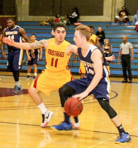 Men BB LMC vs. Mendocino. Feb 16, 2016. LMC Gym, Pittsburg, Ca., The Quarter play offs for Bay Valley Athletic League. LMC player #11 Matt Sisneros blocks Mendocino player #14 Paul Steliga. 