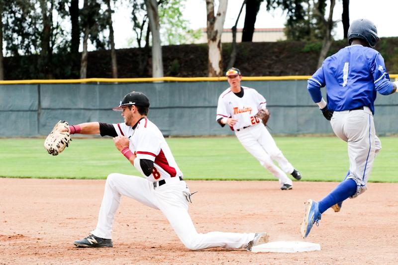 Mens Baseball, LMC vs. CCC on Apr. 11, 2016. Pittsburg, Ca.. LMC player #8 Jason Kreske catches the ball before CCC player #1 Jamal Ruthledge makes it to first base. 