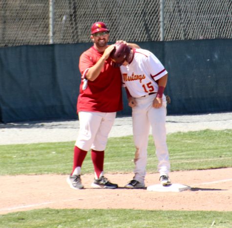 Mens Baseball, LMC vs.Solano Commnunity College. LMC player #15 Jared Ambuehl getting congratulated by coach Anthony for a well played run.LMC, Pittsburg, Calif. April 23, 2016. Cathie Lawrence/Experience.