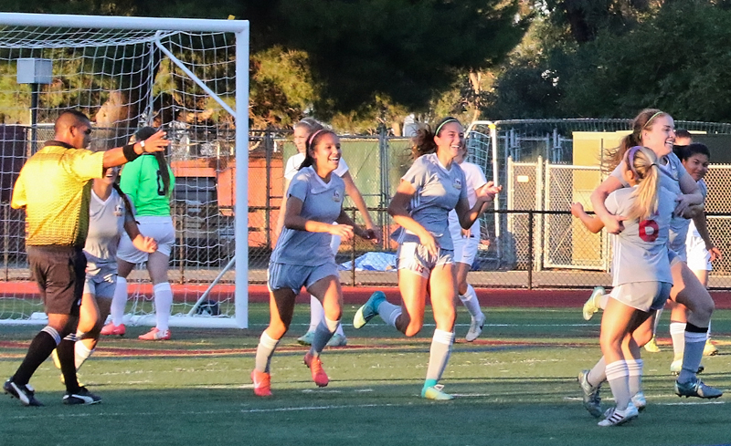 Los Medanos College women's soccer team celebrates after Sydney Torrano scores the game-winning goal in the second half.