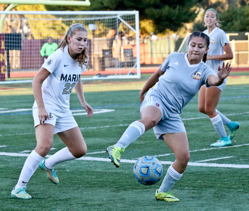 Los Medanos College Adriana Urrutia battles with a Marin Mariners defender during the Stangs 1-0 victory at home on Oct 27.