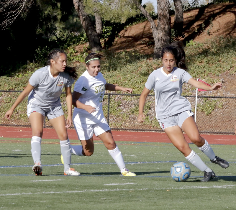 LMCs Vanessa Kualapai attempts to stay away from the Napa Valley College players during the Mustangs 2-0 victory at home Oct. 3