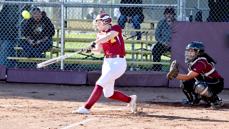 Los Medanos Colleges Jenny Morgan swings big in her at-bat.