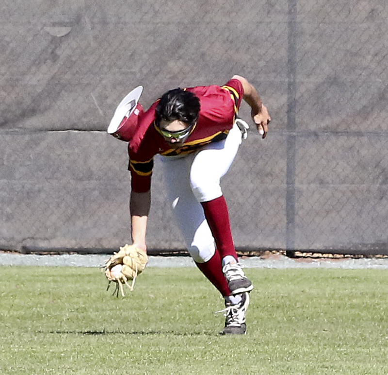 Mustang Josiah Peterson catches a ball hit deep into the outfield.