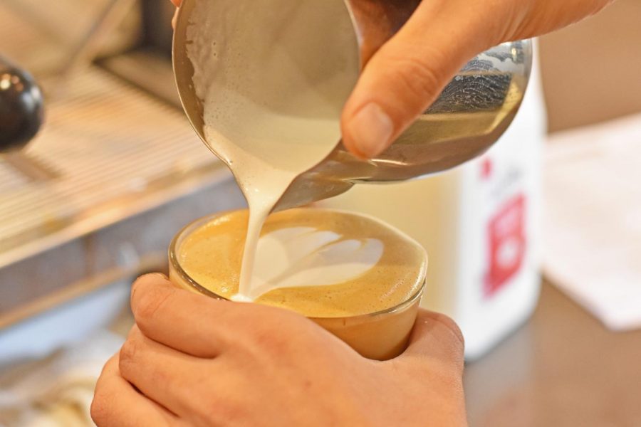 Barista makes coffee art. 