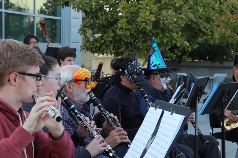 The brass section performs in costume during the impromptu concerto. 
