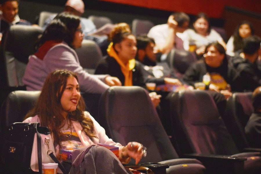 Domonique Echeverria and other moviegoers in their seats await the premiere of “Blindspotting.”