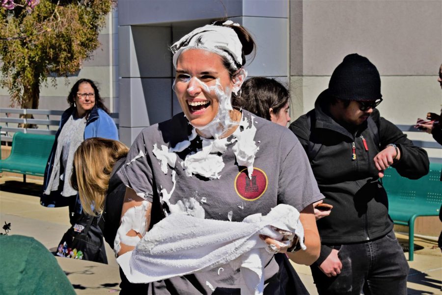 Speech and debate professor Marie Arcidiacono-Kaufman receives a pie to the face after receiving the most votes for Pie in the Face. 
