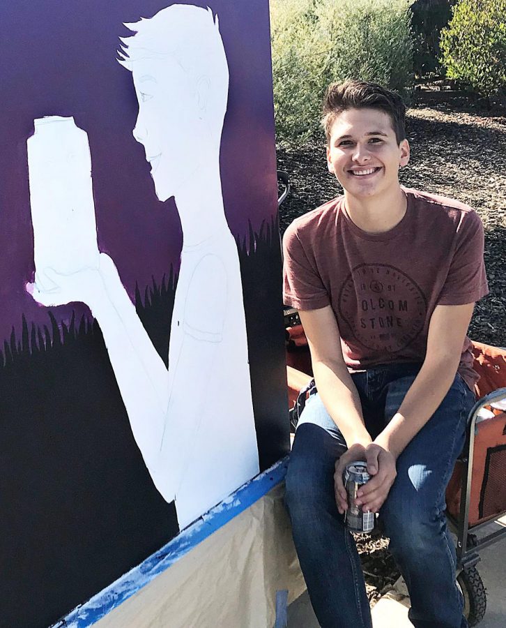 LMC student artist Matthew DAmico in front of his painted utility box.