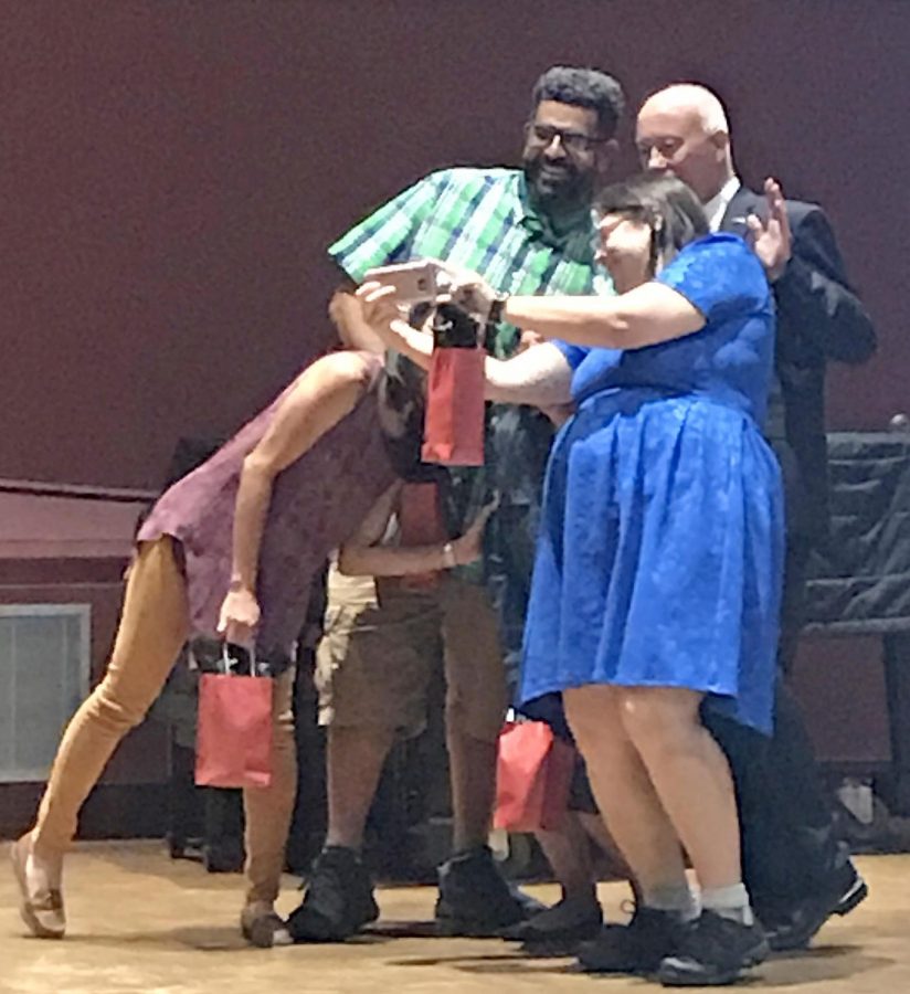President Bob Kratochvil poses for a selfie with George Olgin, Adrianna Simone and Girlie Sison during LMC’s Opening Day gathering in the Recital Hall Aug. 23.