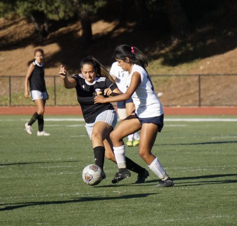 Jazmin Alaniz, No. 2, battles a Yuba College player for the ball during the second half of the game. 