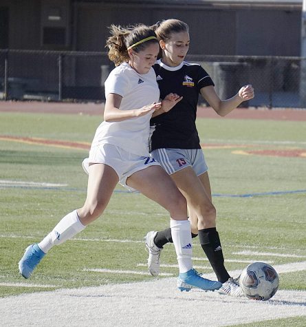 Eryn Wheatley, No. 15, battles for the ball during a defensive play in a soccer game against Solano College.