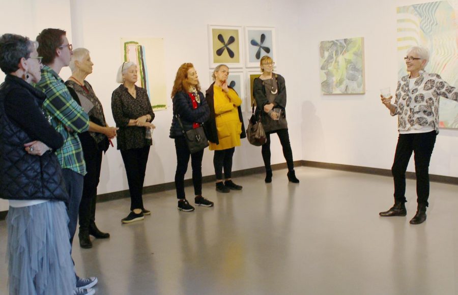 Gallery curator Carol Ladewig speaks to artists in conversation.