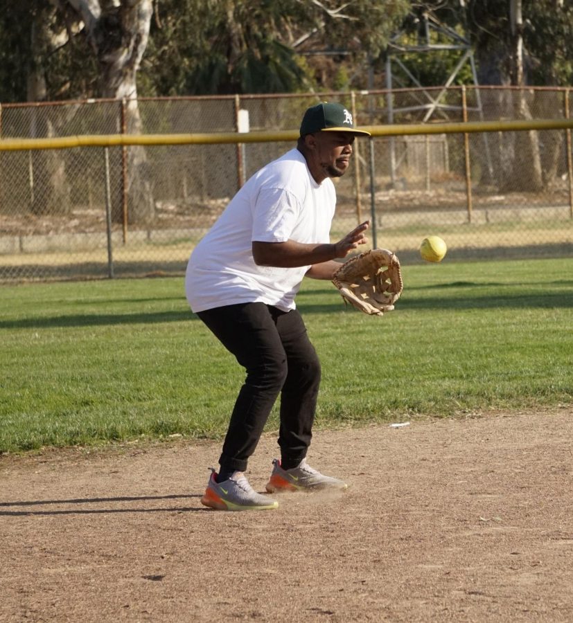 Clinton Calvin makes a catch during a staff softball game on Oct. 11, 2019. 