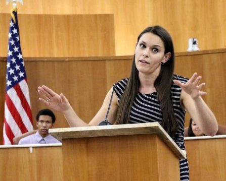 LMC speech professor Marie Arcidiacono speaks at the lectern during a debate in the Pittsburg City Hall Oct 30, 2015.