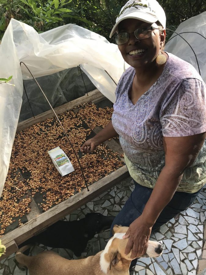 Sandra Brooks shows off the coffee beans she grew on her farm in Costa Rica. 