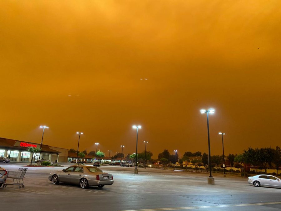 Orange sky consumes the sky at 9:00am in a parking lot off Atlantic Ave in Pittsburg.