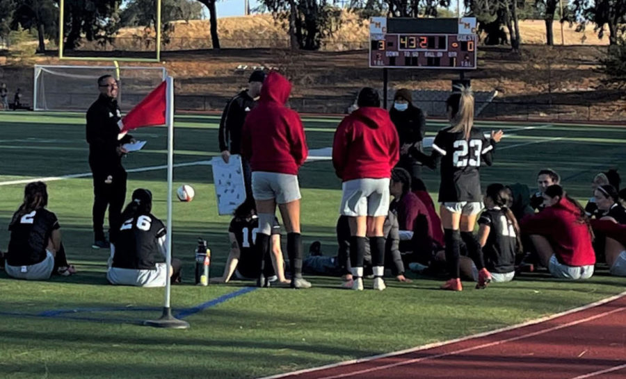 Head+Coach+Zach+Sullivan+and+Assistant+Coach+Sal+Acevedo+discuss+the+gameplan+with+the+womens+soccer+team+at+halftime.+The+Los+Medanos+College+Mustangs+beat+the+Solano+College+Falcons+5-0+Friday%2C+Oct.+22+at+home+in+Pittsburg%2C+California.