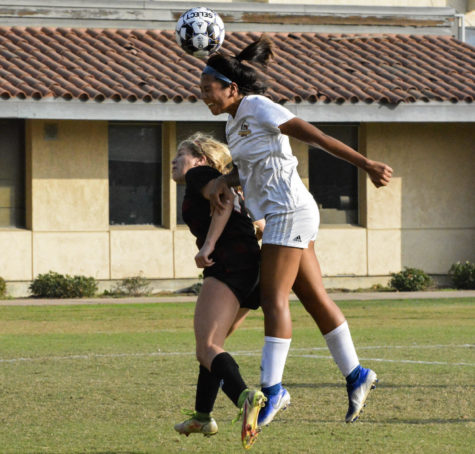 Ariana Chavez, a mid-fielder, knocks the ball out of the competitions possession.