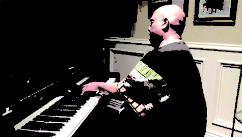 Professor Silvester Henderson plays piano at virtual gospel concert.