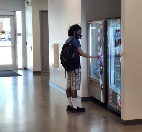 LMC student Nestor Paniagua buys a snack from the vending machine