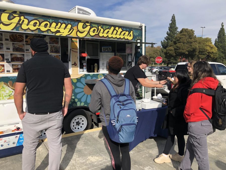 Seth Saoceda (at cash register) taking orders for the Groovy Gorditas Truck