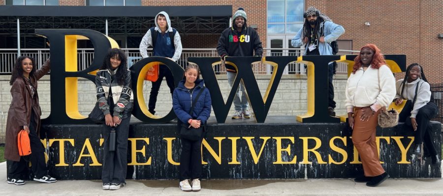 Attendees of the HBCU Tour posing in front of the Bowie State University sign