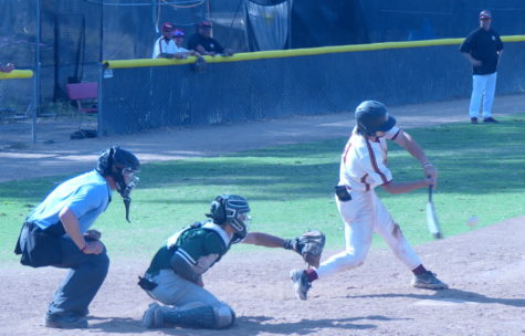 Los Medanos College player Bubba Rocha smashes a ball past the outfield fence for a 2-run home run.