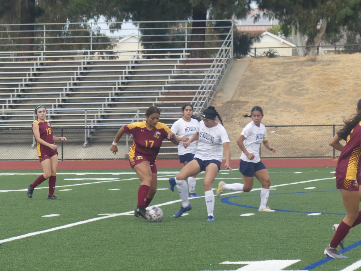 Los Medanos College womens soccer forward Zuleyka Berumen looking to dribble past the Mendocino defender. 