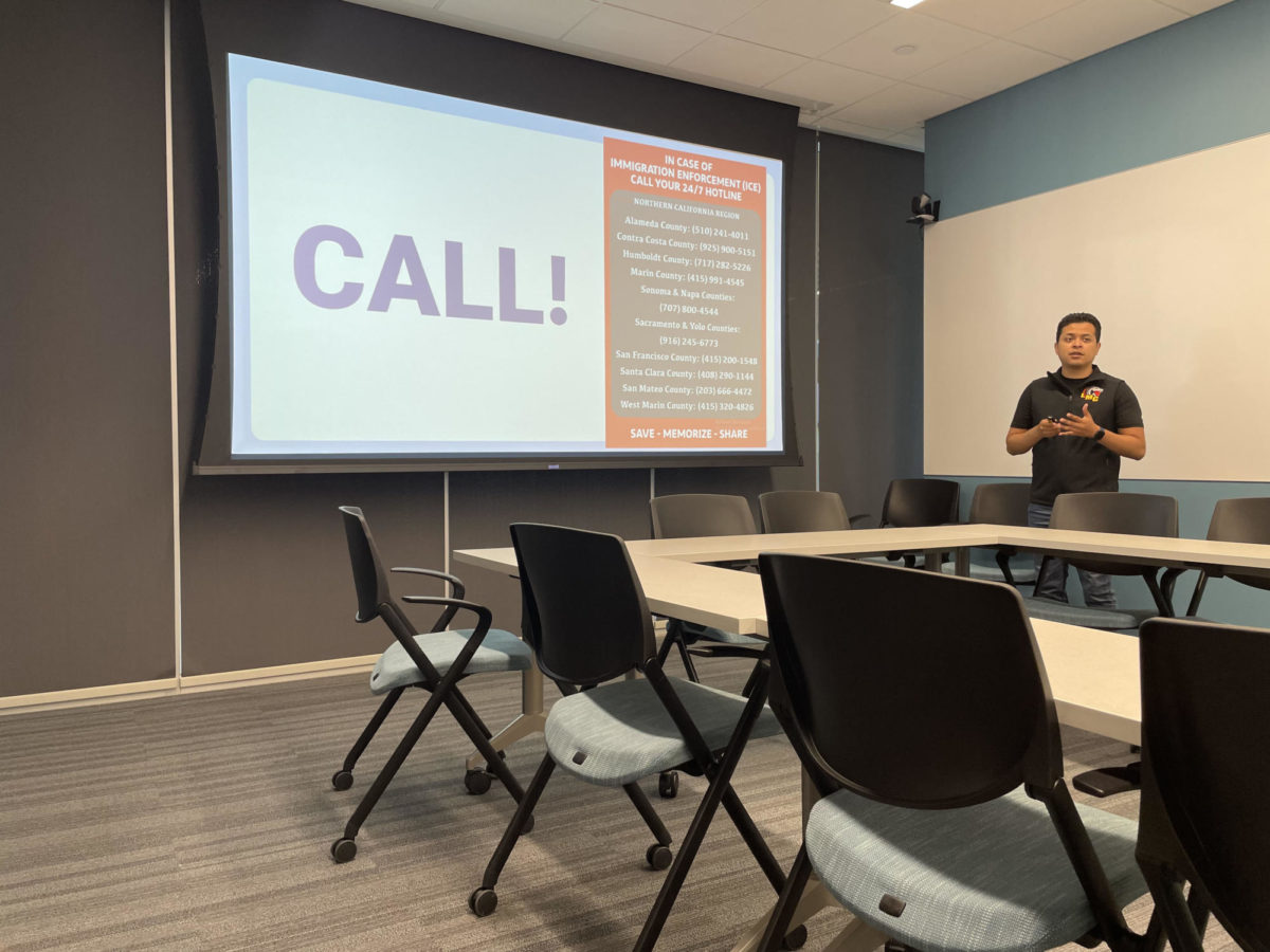 Luis Ramirez speaks about the rights of undcocumented citizens in California, and what we can do to help them. Photo shows the hotline numbers to call incase of a ICE sighting in your area.
