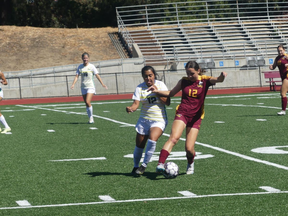 In an earlier match during LMCs conference championship season, No. 12 Reina Ramos fights for the ball against Cañada College.