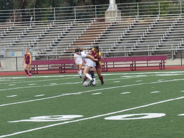 Los Medanos College Mustangs womens soccer player Zuleyka Berumen attempts to steal the ball from the Comets player.