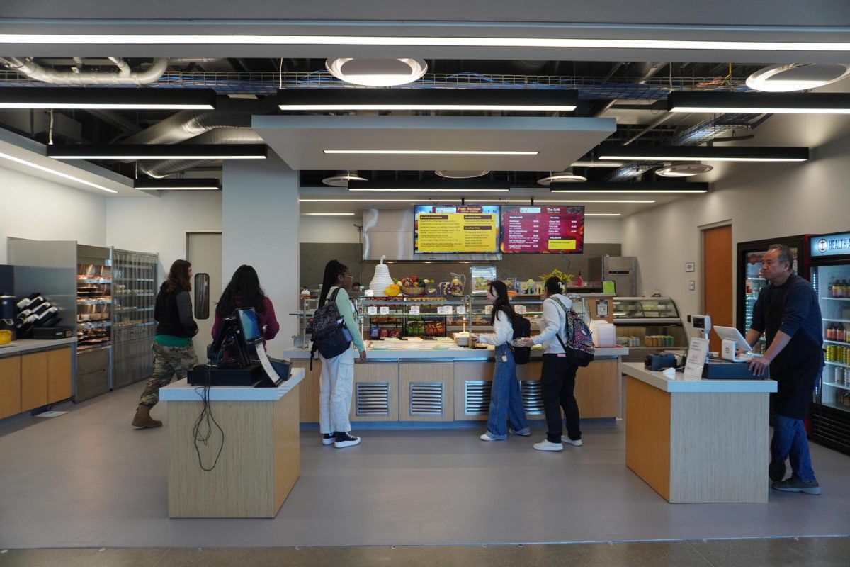 Students visit the options available in the new cafeteria. 