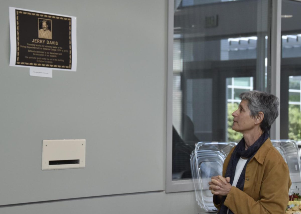 Professor Jancy Rickman looks at future plaque in the LMC Science Building for late Jerry Davis. 